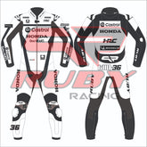 front and rear view of Joan Mirās 2025 MotoGP Castrol Honda test race suit featuring black and white leather panels, sponsor logos including HRC, Castrol, VR46, and Michelin, with number 36 on the leg and back ā custom rider suit with RUBY Racing branding.